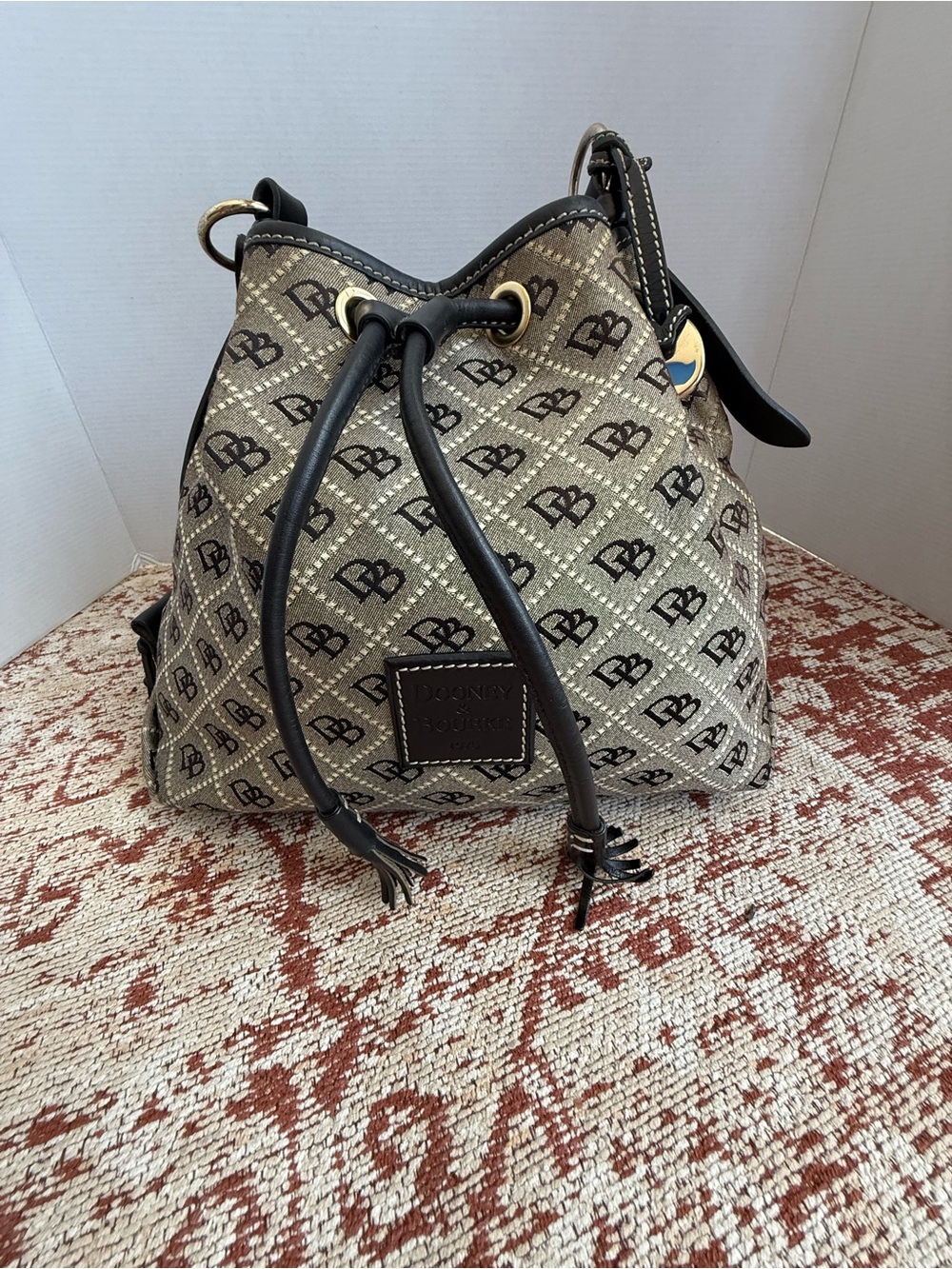 Dooney & Bourke Drawstring Bucket Bag Beige and Black Monogram Drawstring Purse